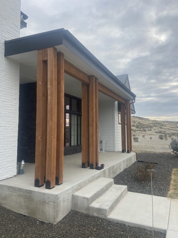 new home's heavy front porch and adjacent concrete (image 1)