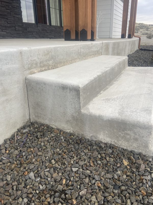 new home's heavy front porch and adjacent concrete (image 5)