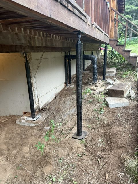 house crawl-space supports and adjacent deck (image 8)