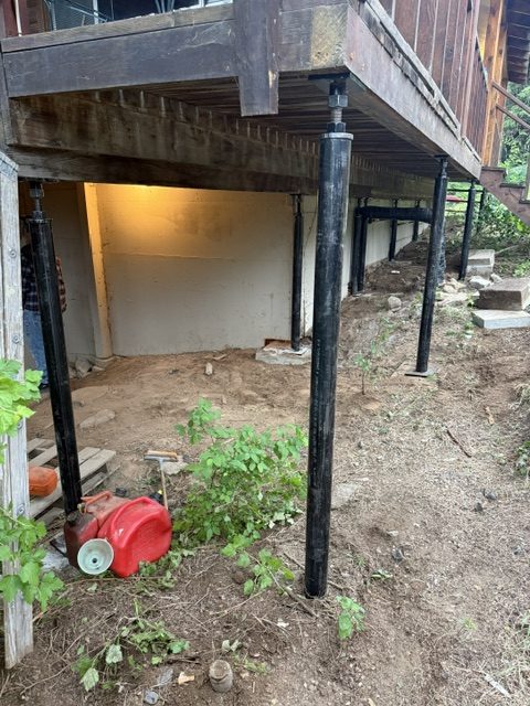 house crawl-space supports and adjacent deck (image 4)