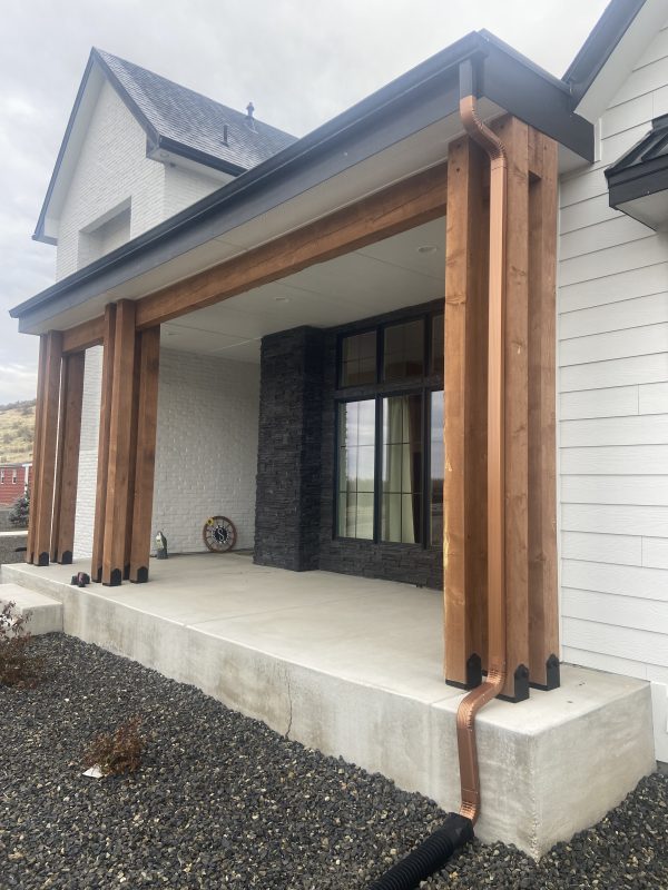 new home's heavy front porch and adjacent concrete (image 2)