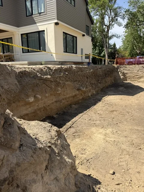 Chemical shoring excavation running along a home foundation